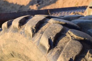 What causes tire feathering?